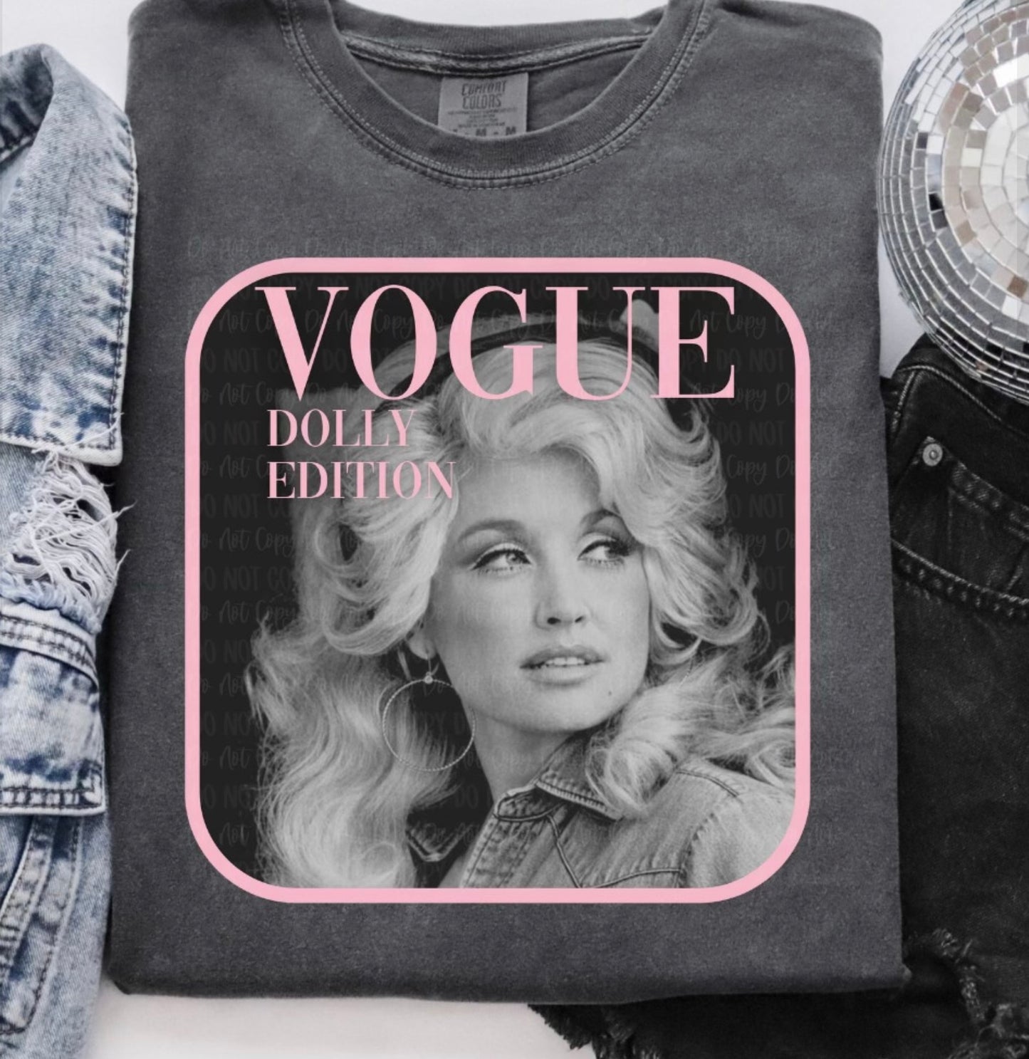 Gray sweatshirt with a graphic of Dolly on a magazine cover design, labeled 'Vogue Dolly Edition'.